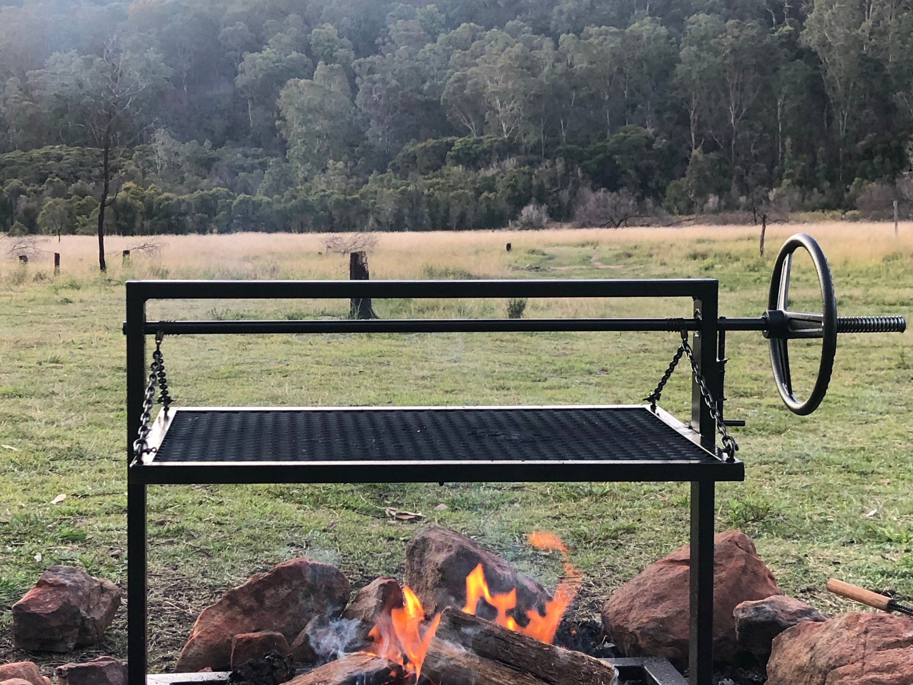 Portable charcoal parrilla BBQ perfect for fire pits and camping